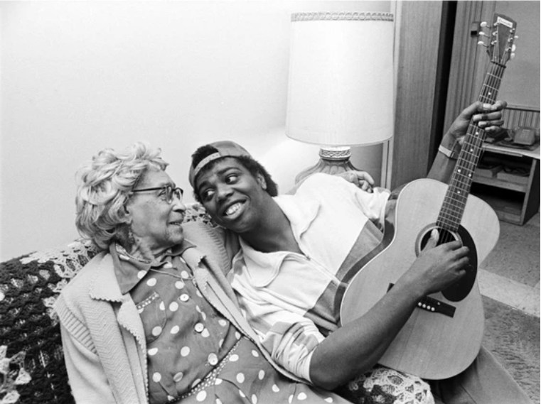 Nora Hendrix celebrating her 99th birthday with grandson Henri Brown at the Biltmore Hotel, 1982